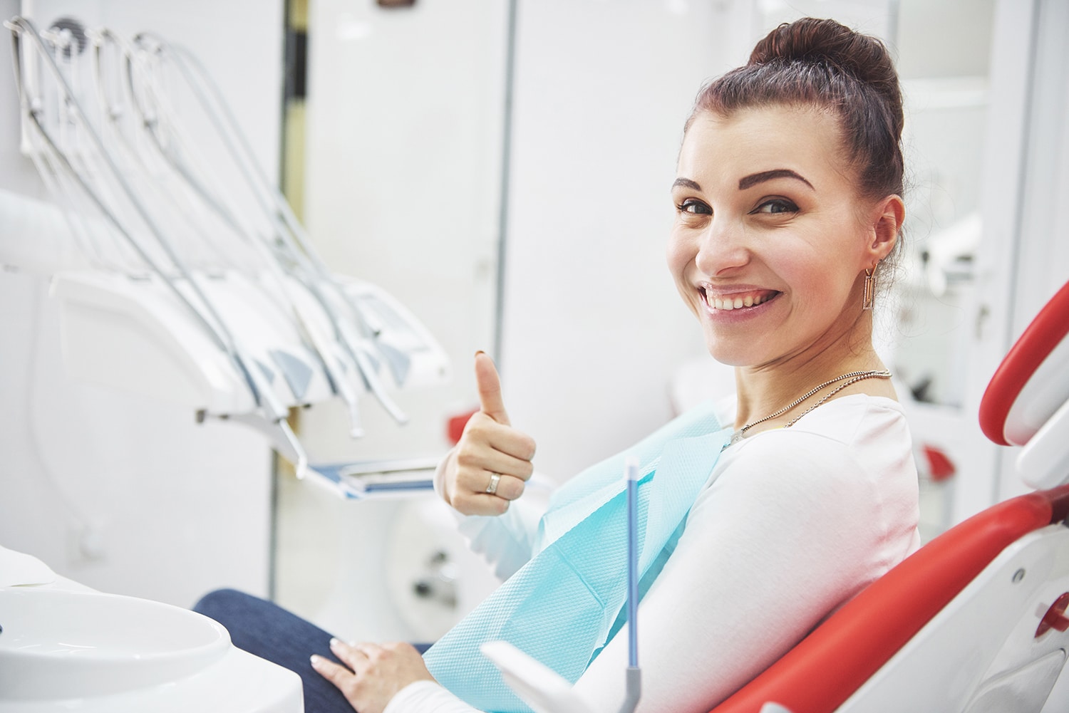 patient showing her smile after dental treatment